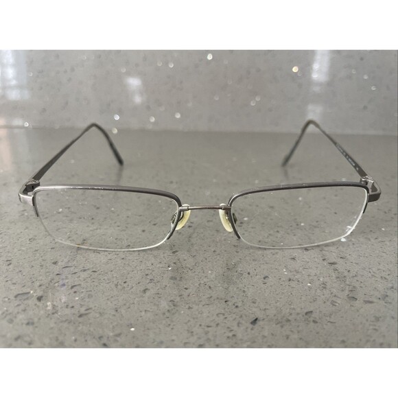 Flexon by Marchon 672 Eyeglasses Frame ONLY Silver metal frame 52-19-145 half - Picture 1 of 12